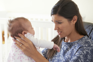 Frustrated Mother Suffering From Post Natal Depression