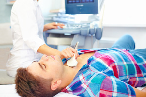 man undergoing the medical ultrasound examination